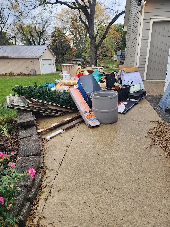 Dumpster being loaded with debris for 3 Yard Dumpster Rental in Imlay